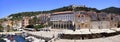 Panoramic view of Hvar, including the fortress on the hill and shops, restaurants and harbor on the foreground