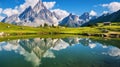 Majestic Reflections: Panoramic View of the Matterhorn Mountain Mirrored in a Lake