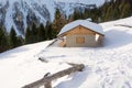 Panoramic view of idyllic winter wonderland with mountain tops and traditional mountain chalet in the Dolomites Royalty Free Stock Photo