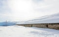 Panoramic view of idyllic winter wonderland with mountain tops and traditional mountain chalet in the Dolomites Royalty Free Stock Photo