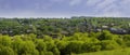 Panoramic view of Inzhavino village in Voroninsky National Park, Tambov Oblast, Russia. River, trees and the field on a