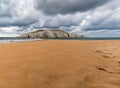 Panoramic view of Isla del Castro with sandy Covachos beach, Santander, Cantabria, Spain. Rocky island and sandy spit on