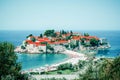 Panoramic view of island of Sveti Stefan, on old stone houses wi Royalty Free Stock Photo