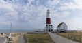 Panoramic view of the Isle of Portland bill lighthouse near Weymoth Dorset coast England UK with a cloudy sky and the ocean in the Royalty Free Stock Photo