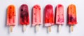 Panoramic view of isolated orange and strawberry popsicles on a white background. Generative AI Royalty Free Stock Photo