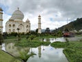 Taj mahal and boats of Jaime Duque Park surrounded by lakes and grasslands