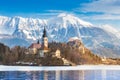 Panoramic view of Julian Alps, Lake Bled with St. Marys Church of the Assumption on the small island. Bled, Slovenia