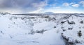 Panoramic view of the Kerid Volcano Iceland with snow and ice in the volcanic crater lake in Winter under a blue sky Royalty Free Stock Photo