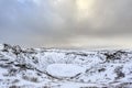 Panoramic view of the Kerid Volcano  Iceland with snow and ice in the volcanic crater lake in Winter under a blue sky Royalty Free Stock Photo