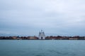 Panoramic view of La Giudecca taken from the lagoon at dusk on a cloudy winter`s day, Venice, Italy