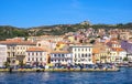 Panoramic view of La Maddalena old town quarter in Sardinia, Italy with port at the Tyrrhenian Sea coastline and island mountains