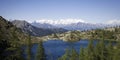 Panoramic view of a lake on the alps Royalty Free Stock Photo