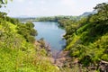 Panoramic view of a lake flanked by greenery
