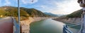 Panoramic view of the lake formed by a dam in the summer period of drought Royalty Free Stock Photo