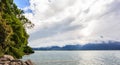 Panoramic view of Lake Geneva, one of Switzerland`s most cruised lakes in Europe, with sky full of clouds after the rain Royalty Free Stock Photo