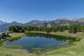 Panoramic view of the Lake of Lod, Chamois, Valtournenche, Aosta valley, Italy, in the summer season Royalty Free Stock Photo