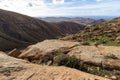 Panoramic view at landscape between Betancuria and Pajara  on Fuerteventura with multi colored volcanic hills and mountains Royalty Free Stock Photo