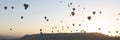 Panoramic view landscape with hot air balloons, sunrise and mountains on background