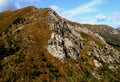 Landscape with mountains and green hills in the foreground against a blue sky with clouds on Mount Cimetta in Switzerland Royalty Free Stock Photo