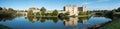 Panorama of Leeds Castle near Maidstone, Kent UK. Castle is reflected in the lake. Photographed on a crisp, clear day in autumn. Royalty Free Stock Photo