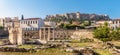 Panoramic view of Library of Hadrian, Acropolis in distance, Athens, Greece. It are famous tourist attractions of city. Urban Royalty Free Stock Photo