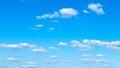 Panoramic view of light cumuli clouds in blue sky