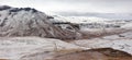 Panoramic view of light snowfall at Golden Gate as it covers the Drakensberg mountains on a cold morning.