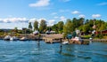 Panoramic view of Lindoya island on Oslofjord harbor near Oslo, Norway, with Lindoya Ost marina and summer cabin houses at