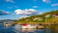 Panoramic view of Lindoya island on Oslofjord harbor near Oslo, Norway, with Lindoya Vest marina and summer cabin houses at