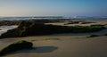 Panoramic view of linear rock formations exposed at low tide along Pacific Coast Royalty Free Stock Photo