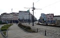 View of Lion`s Bridge from 1889 with lion sculptures, ancient buildings, intersection and traffic lights