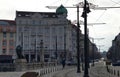 View of Lion`s Bridge from 1889 with lion sculptures, ancient buildings, intersection and traffic lights