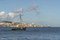 Panoramic view of Lisbon with traditional Seixal sailing boat in the foreground Royalty Free Stock Photo