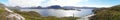 Panoramic view of a loch and hills