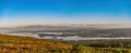 Panoramic view of lough Leane with Ross Island and castle on a sunny foggy summer morning