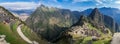 Amazing panoramic view of Machu Picchu ruins in Peru. Behind we can appreciate big and beautiful mountains full of green vegetatio