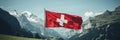Panoramic view of majestic swiss mountain range with the flag of switzerland fluttering in the wind
