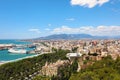 Panoramic view on Malaga City. Cityscape of Malaga with down town center with City Hall, Cathedral and Mediterranean Sea port Royalty Free Stock Photo