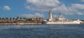 Panoramic view of Malaga harbor and luxurious yacht anchored.