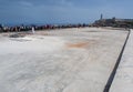 Many people sitting on the Malecon in Havana