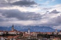 Panoramic view of medieval small town Kranj with Alps mountains covered with snow in the distance Royalty Free Stock Photo