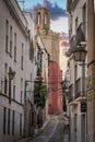 Panoramic view of a medieval town in Spain at sunset with narrow stone houses and streets.