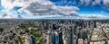 Panoramic view of the Melbourne skyline with white floating clouds above the city. Australia.