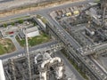 Panoramic view of metal, mechanical and piping structures in an oil and gas refinery Royalty Free Stock Photo