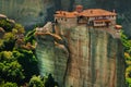 Panoramic view of Meteora monastery on the high rock and road in the mountains at spring time, Greece Royalty Free Stock Photo