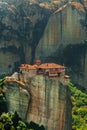 Panoramic view of Meteora monastery on the high rock and road in the mountains at spring time, Greece Royalty Free Stock Photo