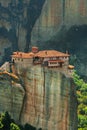 Panoramic view of Meteora monastery on the high rock and road in the mountains at spring time, Greece Royalty Free Stock Photo