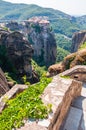 Panoramic view from Meteoron Monastery cliff stone stairs on scenic Meteora landscape rock formations with Monastery of Varlaam on Royalty Free Stock Photo