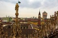 Milan skyline spires and statue of Duomo di Milano Italy