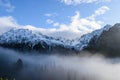 panoramic view of misty forest in mountain area with mountains h